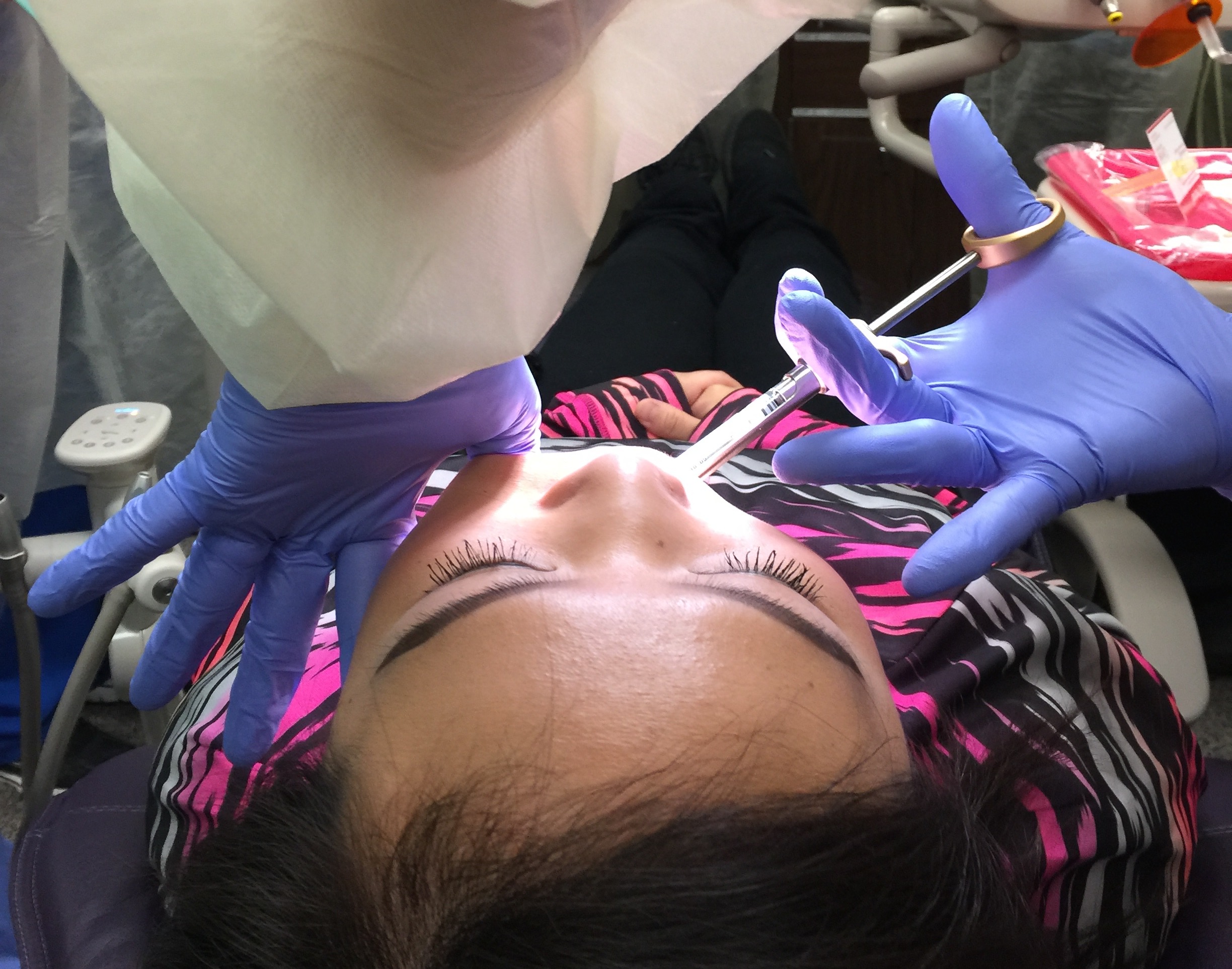 Woman Getting Dental Treatment